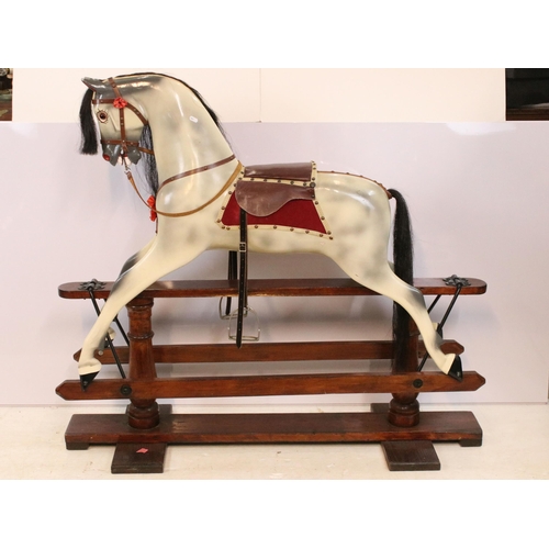 602 - Late 20th Century rocking horse with painted details, having a horse hair mane and tail, glass eyes ... 