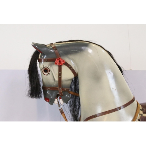 602 - Late 20th Century rocking horse with painted details, having a horse hair mane and tail, glass eyes ... 