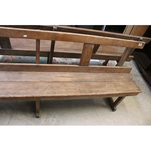 603 - Late 19th / early 20th Century oak station bench having a planked seat with pierced supports. Measur... 