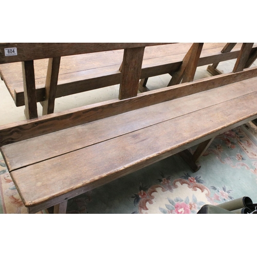 604 - Late 19th / early 20th Century oak station bench having a planked seat with pierced supports. Measur... 