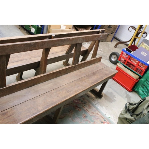 604 - Late 19th / early 20th Century oak station bench having a planked seat with pierced supports. Measur... 