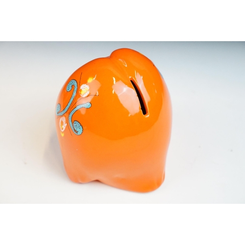 19 - In the manner of Baldelli, mid century Italian orange glazed ceramic moneybox in the form of an owl,... 