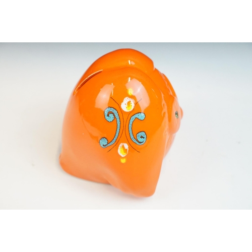 19 - In the manner of Baldelli, mid century Italian orange glazed ceramic moneybox in the form of an owl,... 