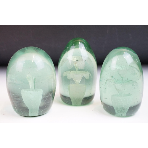 22 - Three hand blown green glass flower dump paperweights