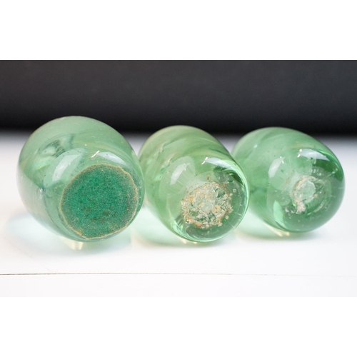 22 - Three hand blown green glass flower dump paperweights