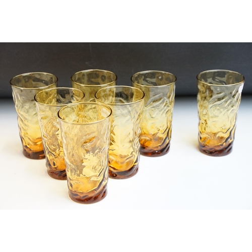 32 - Seven vintage Whitefriars style textured amber drinking glasses, 13cm high