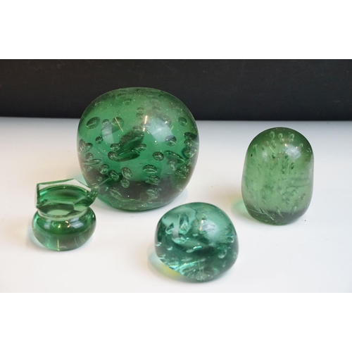 35 - Three hand blown green glass dump paperweights in varying sizes