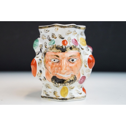 41 - 19th century hand painted Satyr jug of grinning bearded face man with leaves and raised area decorat... 