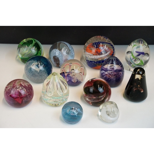 45 - Collection of thirteen Caithness glass paperweights in various sizes, to include Moon crystal, pebbl... 