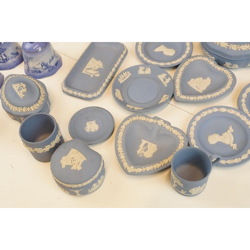 69 - Selection of Wedgwood blue Jasperware to include lidded boxes, plates and vases together with four C... 