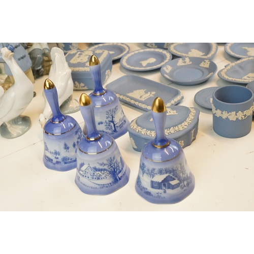 69 - Selection of Wedgwood blue Jasperware to include lidded boxes, plates and vases together with four C... 