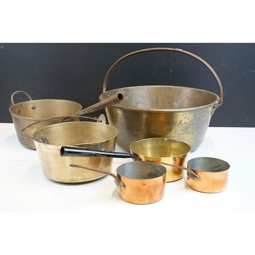 313 - Selection of antique brass and copper sauce jam pans, largest diameter 42cm