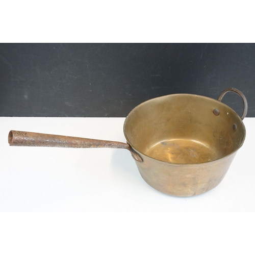 313 - Selection of antique brass and copper sauce jam pans, largest diameter 42cm