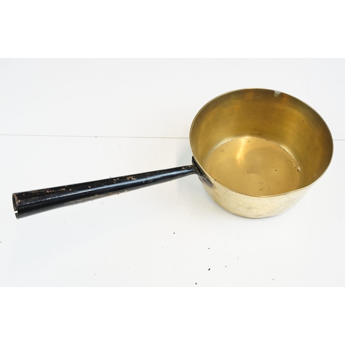 313 - Selection of antique brass and copper sauce jam pans, largest diameter 42cm