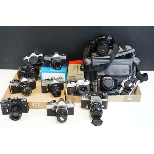 322 - Eleven 35mm SLR cameras and fourteen lenses Featuring a Nikon F fitted with a 105mm f/2.5, Canon AE1... 