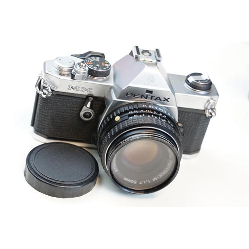 322 - Eleven 35mm SLR cameras and fourteen lenses Featuring a Nikon F fitted with a 105mm f/2.5, Canon AE1... 