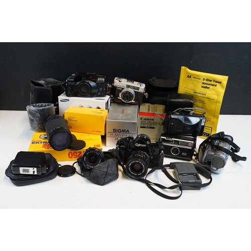 329 - Quantity of cameras to include Canon A-1 fitted with 35mm zoom lens, together with kodak, sigma, can... 