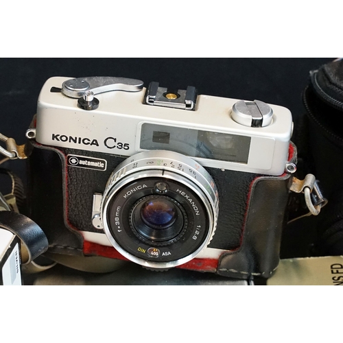 329 - Quantity of cameras to include Canon A-1 fitted with 35mm zoom lens, together with kodak, sigma, can... 