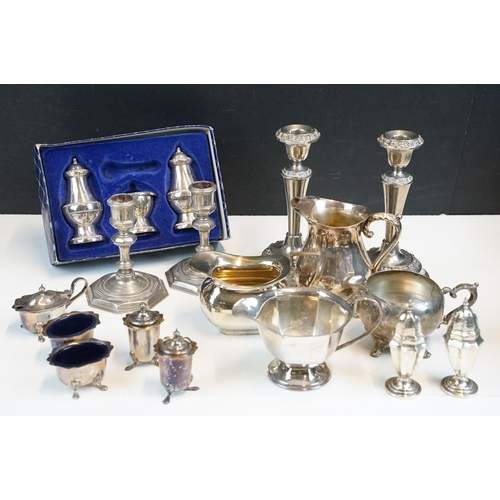 333 - Mixed lot of silver plate including two pairs of candlesticks, milk jugs, pair of pepperettes, and t... 