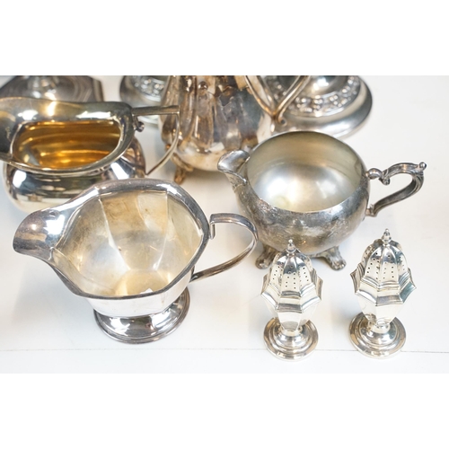 333 - Mixed lot of silver plate including two pairs of candlesticks, milk jugs, pair of pepperettes, and t... 