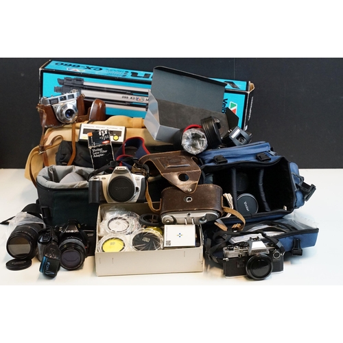 335 - Collection of photographic equipment, cameras and accessories featuring Minolta and Canon SLR's, Min... 