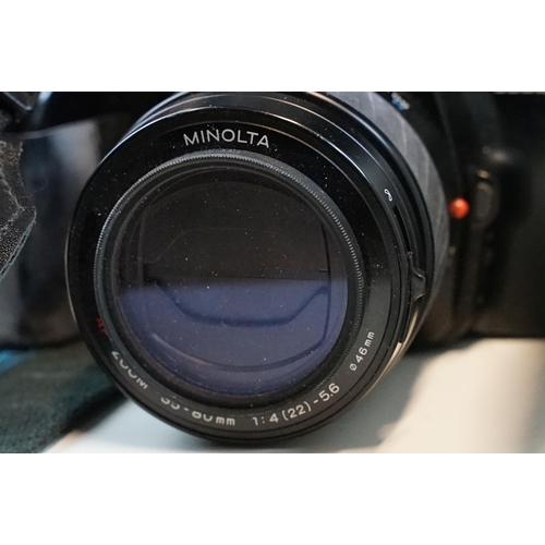 335 - Collection of photographic equipment, cameras and accessories featuring Minolta and Canon SLR's, Min... 