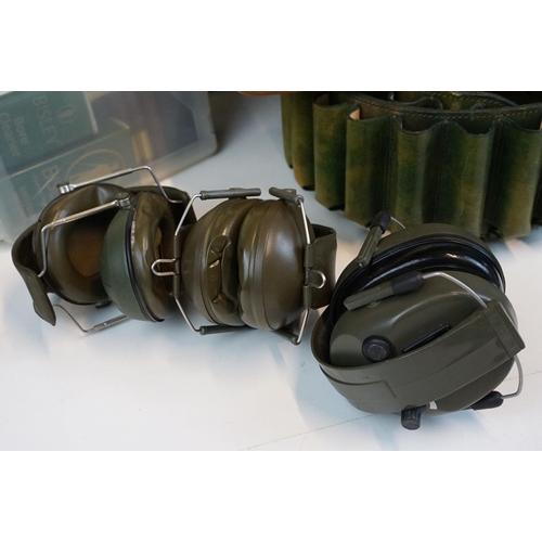 339 - Shooting accessories to include ear defenders, shotgun patches, gun cleaning kit, cartridge belts, c... 