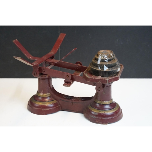 343 - Three sets of vintage weighing scales with weights to include a cast iron set of butchers scales wit... 