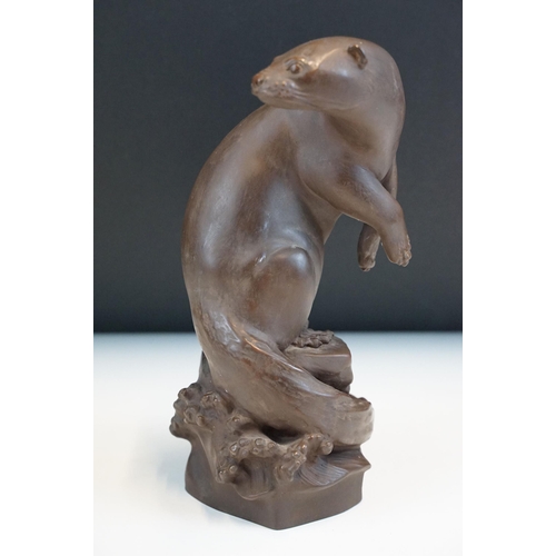 1 - Meissen Bottger Steinzeug red stoneware otter modelled perched on a rock. Impressed marks to base wi... 