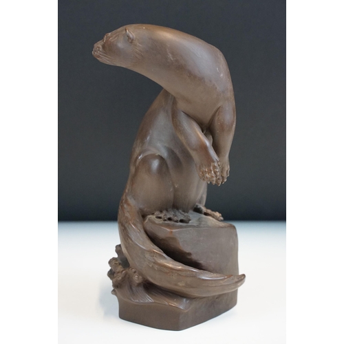 1 - Meissen Bottger Steinzeug red stoneware otter modelled perched on a rock. Impressed marks to base wi... 