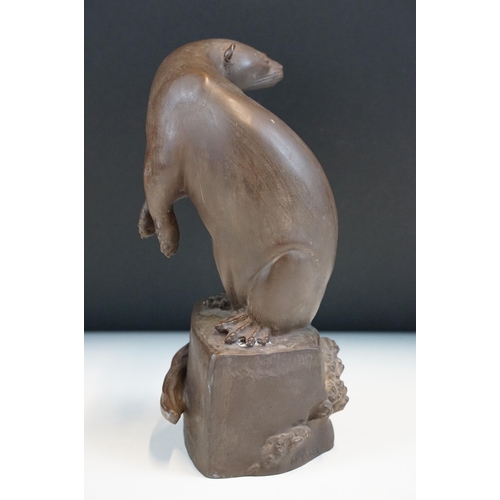 1 - Meissen Bottger Steinzeug red stoneware otter modelled perched on a rock. Impressed marks to base wi... 