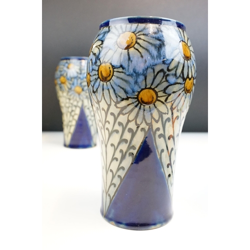 3 - Pair of early 20th Century Royal Doulton stoneware vases with hand painted daisies on a blue ground.... 