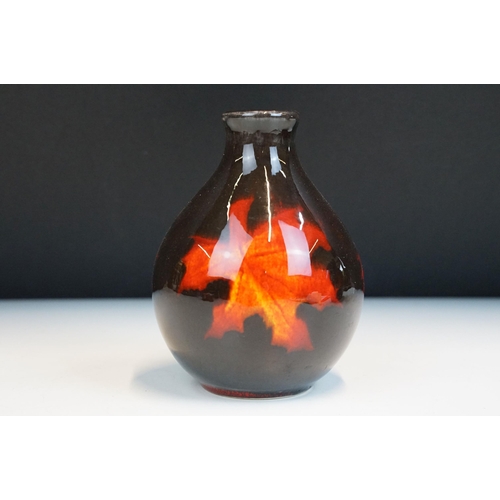 4 - Poole Pottery - group of four pieces to include a Forest Flame vase, lava vase, Gemstone powder box ... 