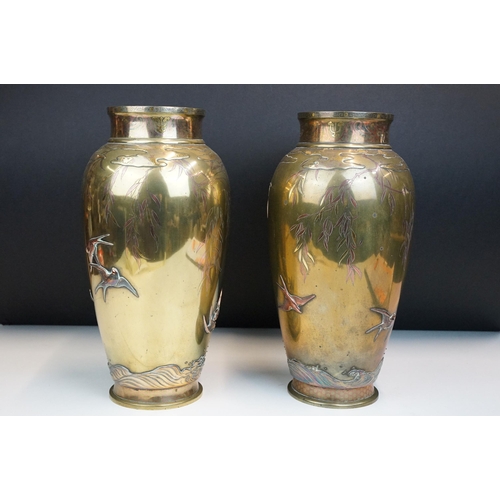 8 - Pair of Japanese Meiji mixed metal vases each decorated with moulded swallows, waves and branches wi... 