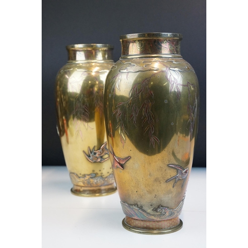 8 - Pair of Japanese Meiji mixed metal vases each decorated with moulded swallows, waves and branches wi... 