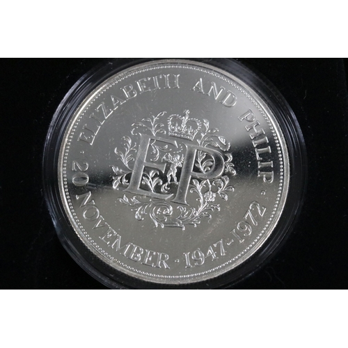 40 - A cased Queen Elizabeth II commemorative silver crown coin collection, comprising of seven full crow... 