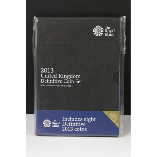 76 - A collection of four Royal Mint United Kingdom brilliant uncirculated annual coin year sets to inclu... 