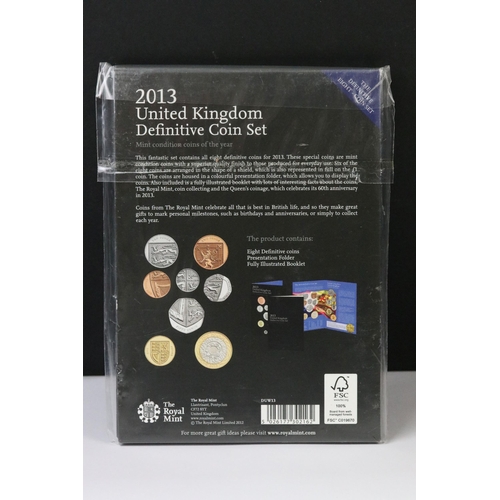 76 - A collection of four Royal Mint United Kingdom brilliant uncirculated annual coin year sets to inclu... 