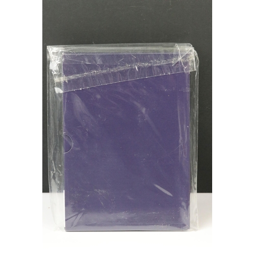 76 - A collection of four Royal Mint United Kingdom brilliant uncirculated annual coin year sets to inclu... 