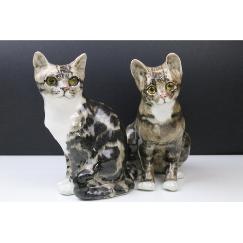 11 - Pair of Winstanley Tabby side angle cat figurines with yellow glass eyes, signed to bases, approx. H... 