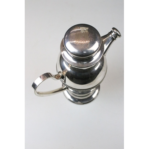 112 - Art Deco silver plate cocktail shaker with loop handle and pouring spout, marked to base ‘ Millers L... 