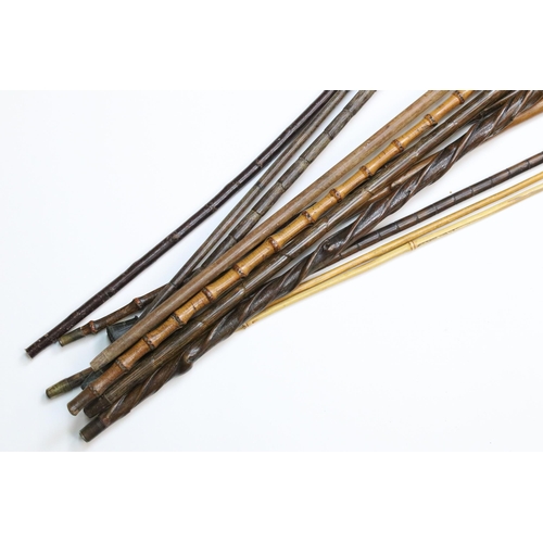 114 - Mixed selection of twelve bamboo and wood walking stick canes, approx. H 93cm