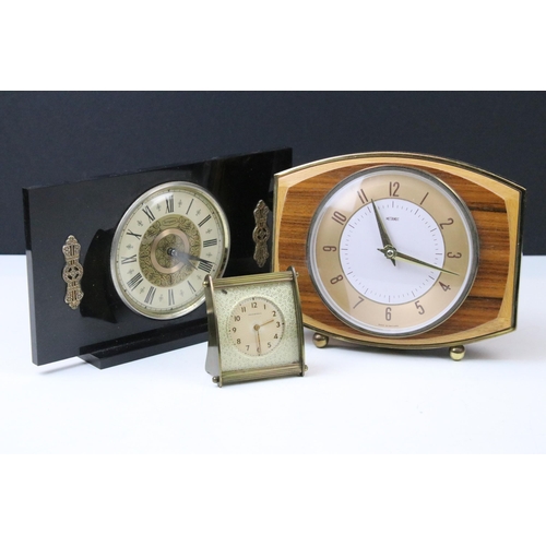 123 - Three mid 20th Century table clocks to include Ingersoll, Metamic and Tempora. Largest measures 21.5... 