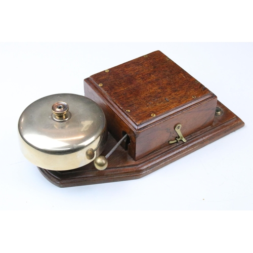 124 - Early 20th century servant’s type bell with oak case, stamped to back G.P.O M 44B 11,  28cm high