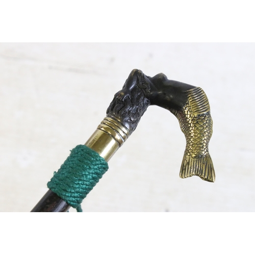 165 - 20th century walking stick cane with brass handle modelled as a mermaid, finished with a green cord ... 