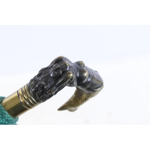 165 - 20th century walking stick cane with brass handle modelled as a mermaid, finished with a green cord ... 