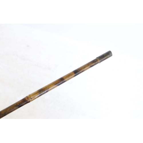 180 - Group of four bamboo walking stick canes to include one metal spiked example and a brass ended reach... 