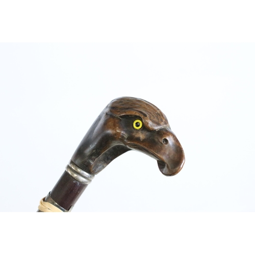 185 - Collection of seven walking sticks, to include: a pottery horse head example, an early 20th century ... 