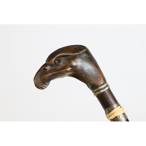 185 - Collection of seven walking sticks, to include: a pottery horse head example, an early 20th century ... 