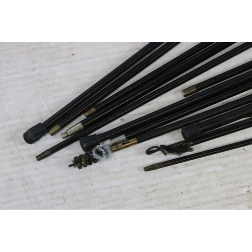 189 - Assorted ebonised wood walking stick canes with silver and horn handle examples and a riding crop